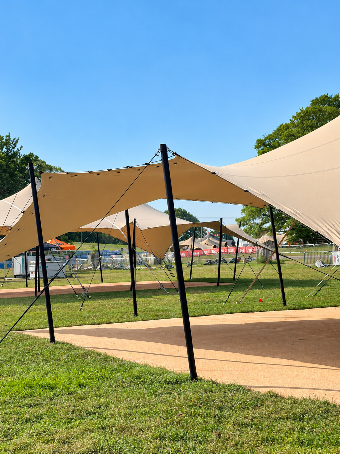 Stretch tent poles and canvas over a garden event deck